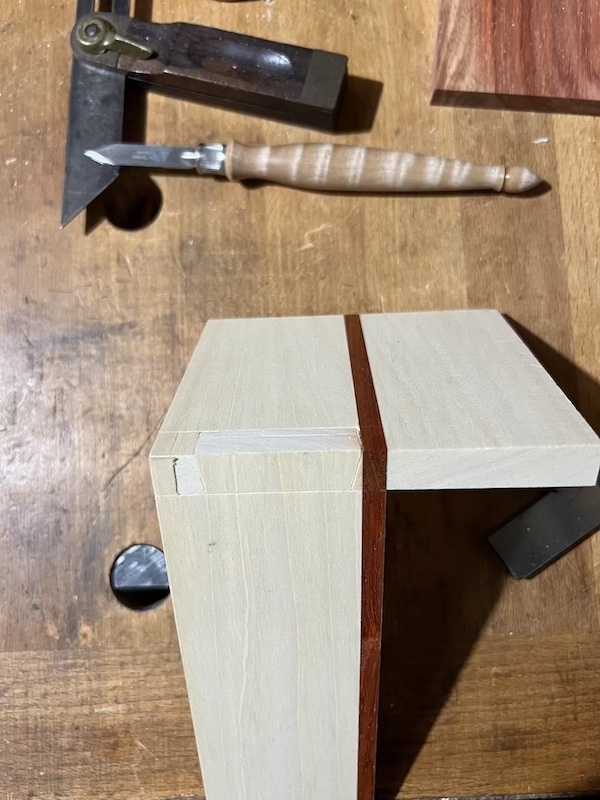 The front side of a mitered dovetail joint.