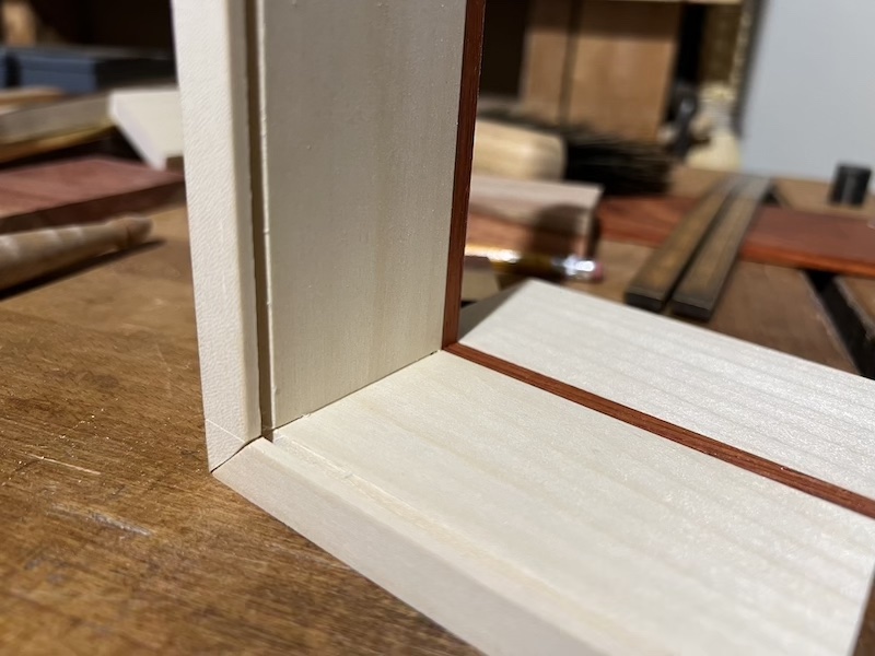 The inside of a mitered dovetail joint.