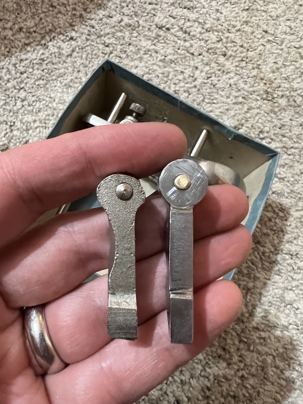 Underside of both blade holders showing the placement of the thumb screw